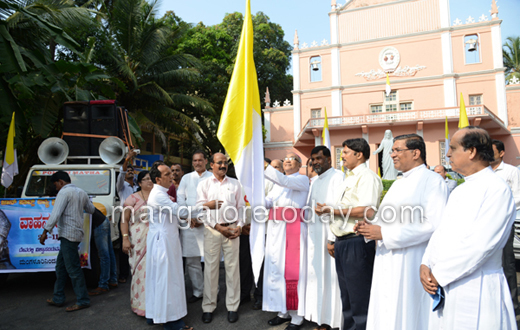vehicle rally carrying the  statue of Pope John Paul II